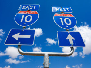 road signs for interstate 10 east and west