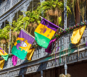Ironwork galleries on the Streets of French Quarter decorated for Mardi Gras in New Orleans